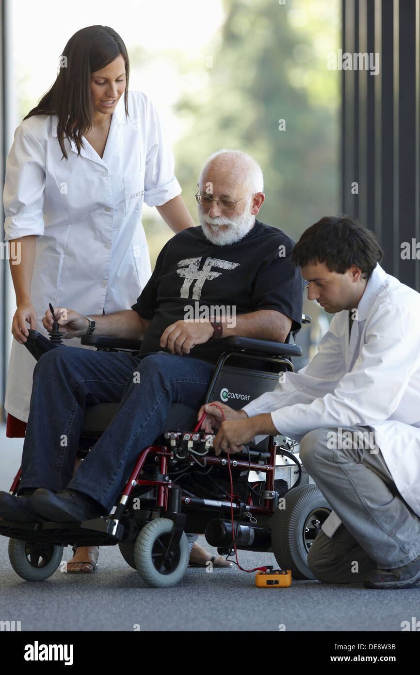 Health and Quality of life Unit researchers developing a control system for intelligent power wheelchair, FIK technology Stock Photo