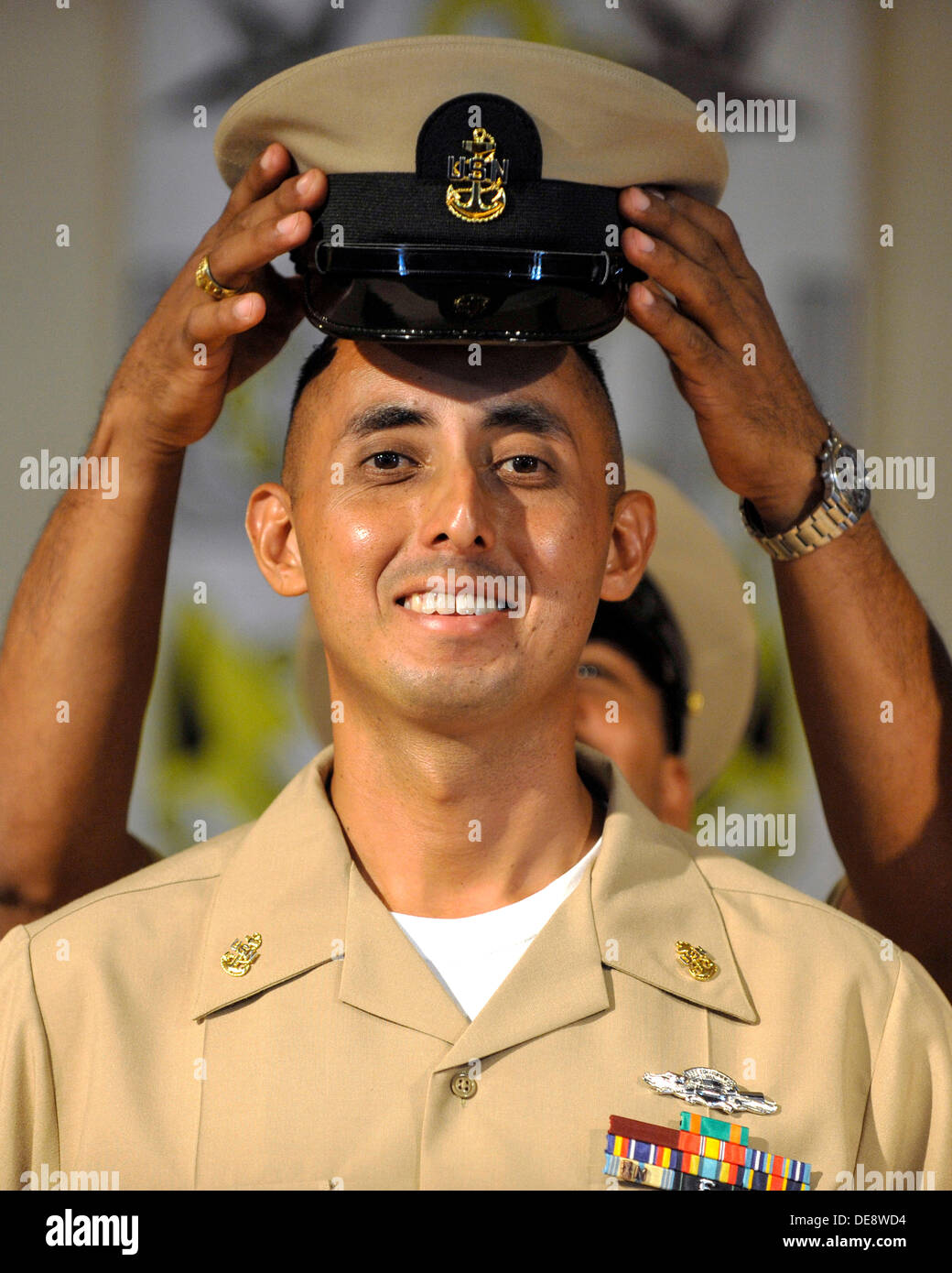 US Navy Chief Boatswain's Mate Gabriel Martinez smiles as he has ...