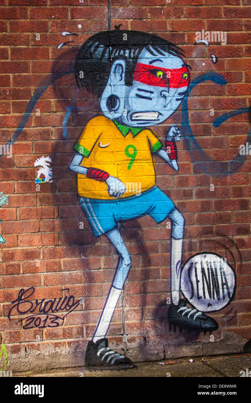 East End London Fish Island Hackney Wick graffiti street urban art mural by South American Cranio & Alex Senna cartoon footballer Stock Photo