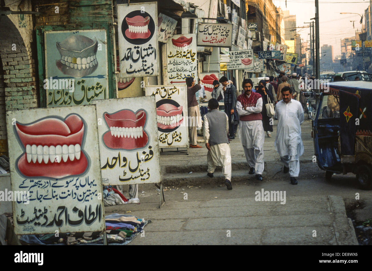 Dentist signs along a street in Pakistan Stock Photo Alamy