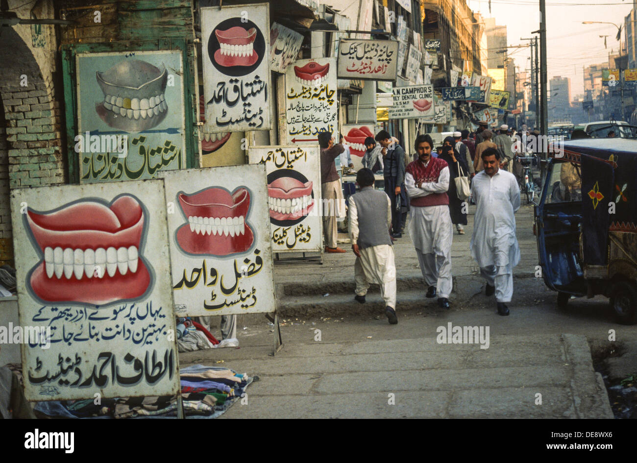 Dentist signs along a street in Pakistan Stock Photo