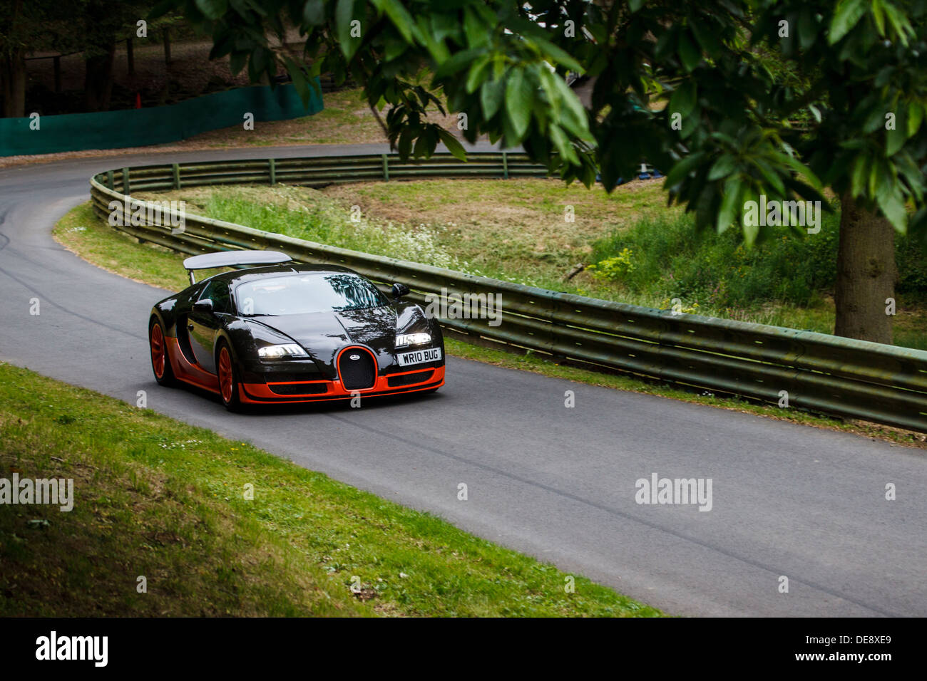A orange and black Bugatti Veyron Super Sport on the track at Prescott Hill, Gloucestershire, England Stock Photo