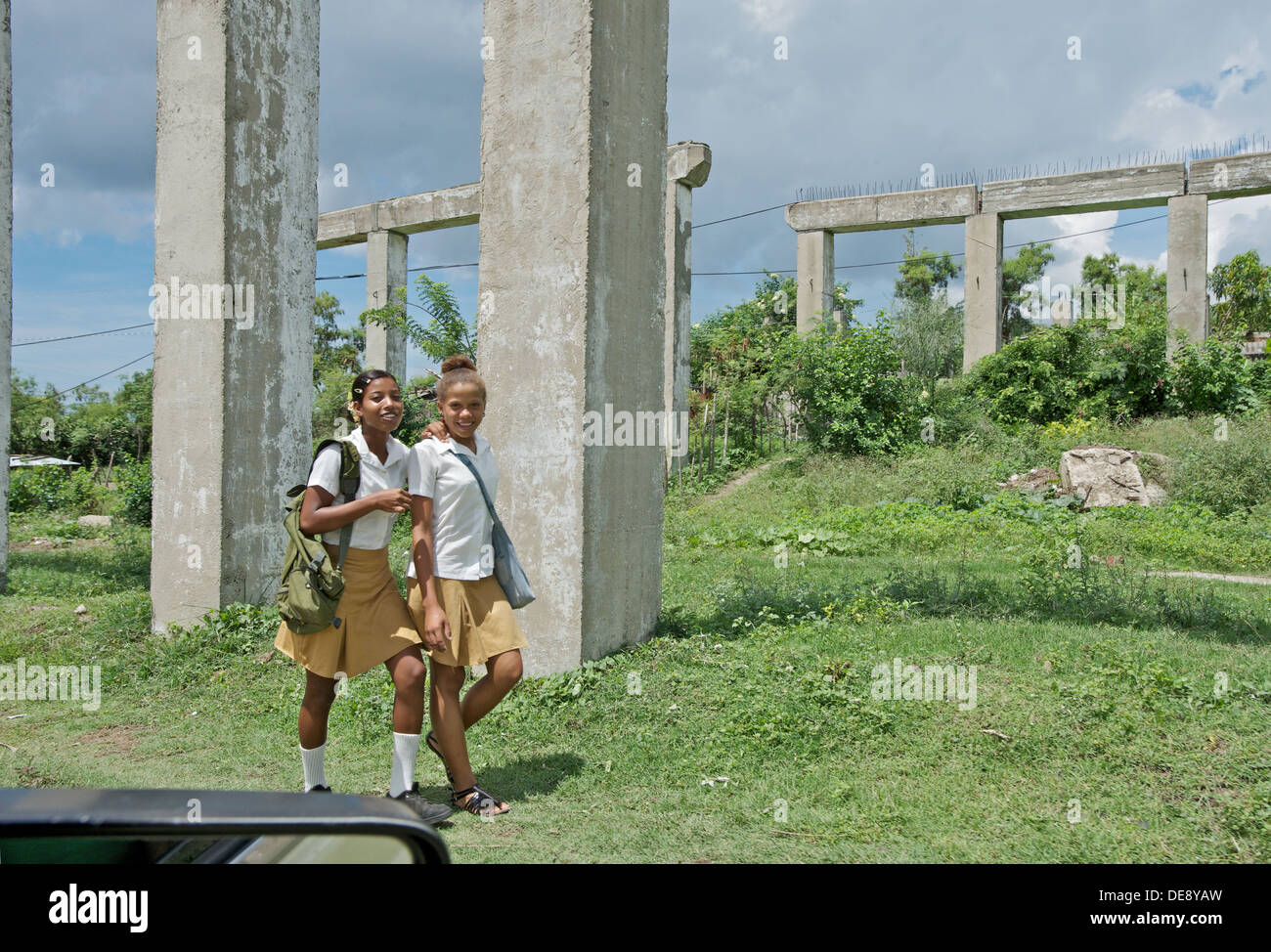 Santiago de Cuba, Cuba, schoolgirl before the ruin of a bridge Stock Photo