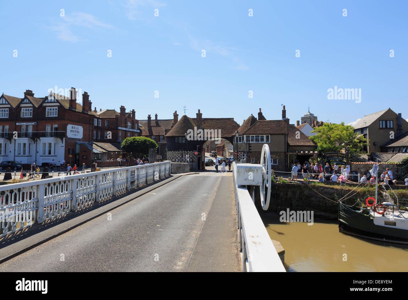View along iron swing toll bridge over River Stour to Barbican Gate in Cinque Port town of Sandwich, Kent, England, UK, Britain Stock Photo