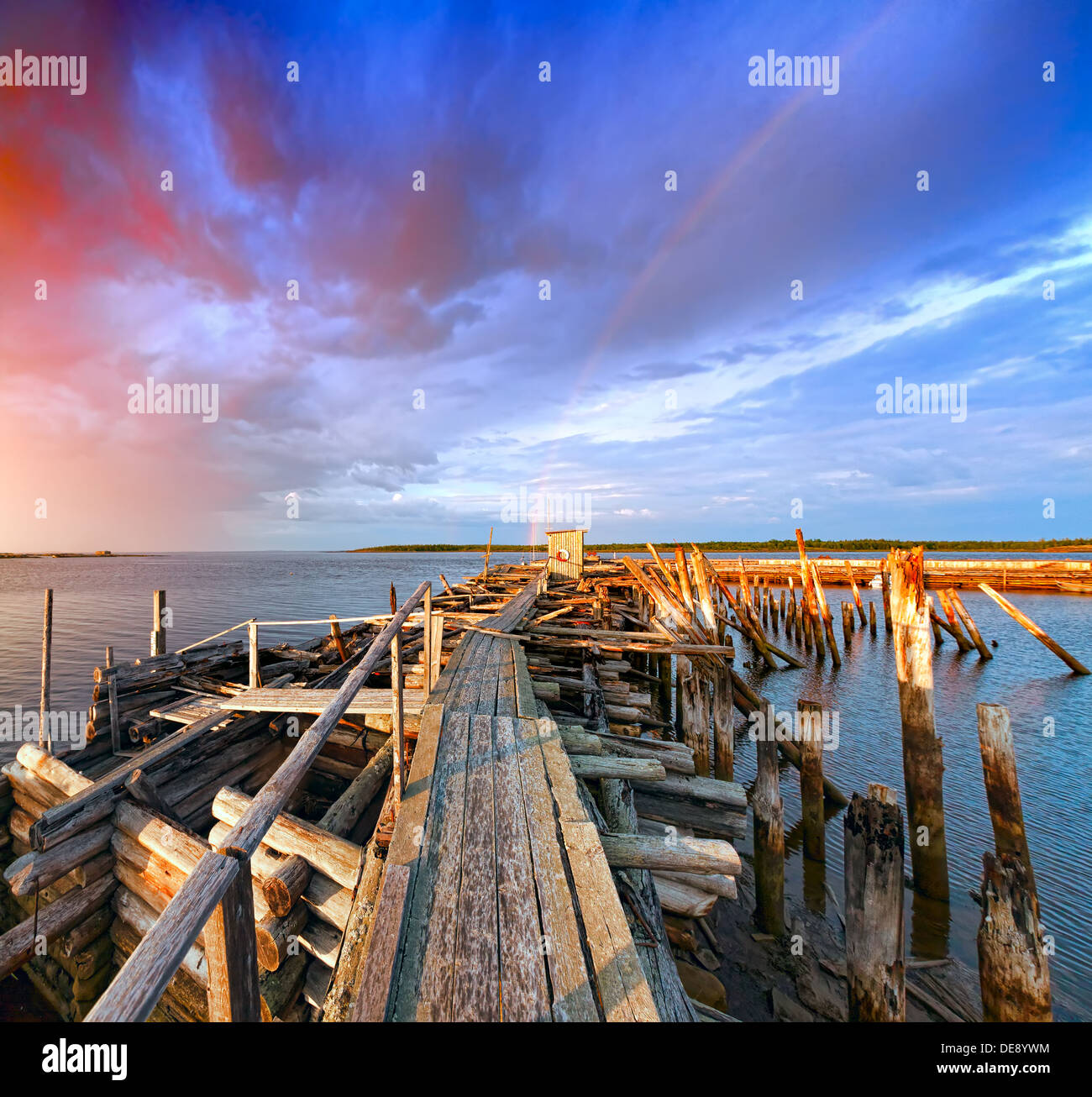 Old wooden pier at sunset. White Sea; Karelia; Russia Stock Photo