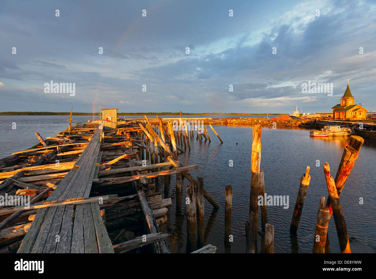 Old wooden pier at sunset. White Sea; Karelia; Russia; Stock Photo