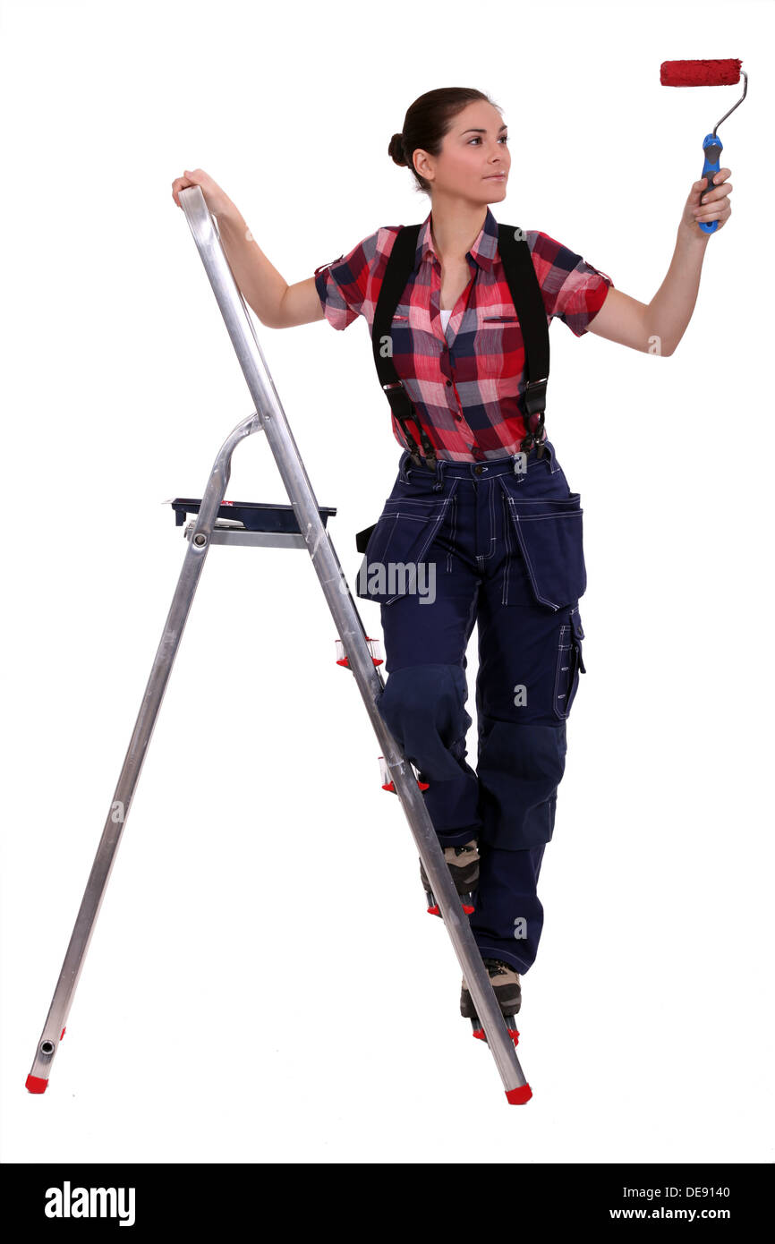 Woman with ladder painting Stock Photo