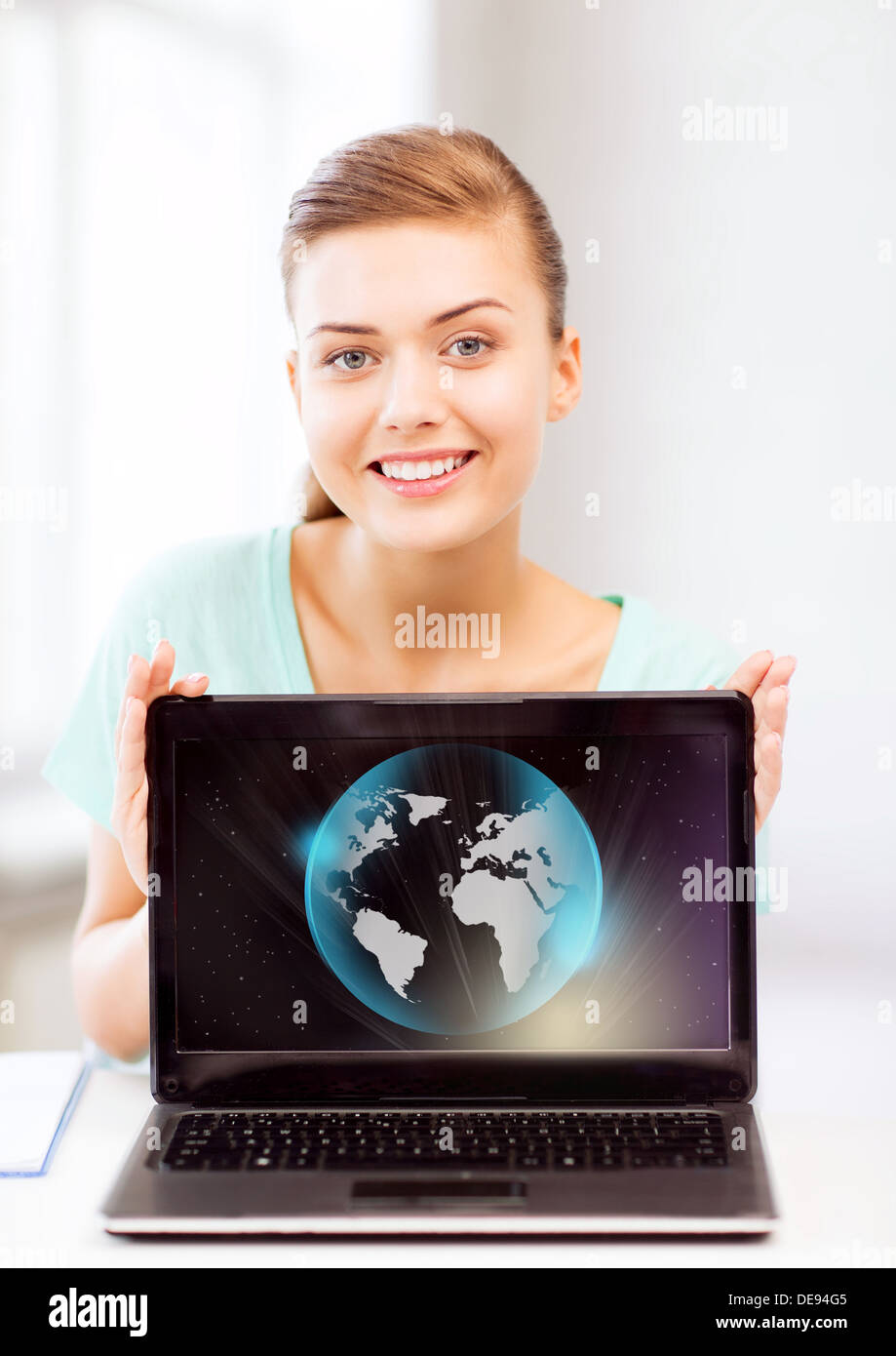 woman with laptop and sphere globe Stock Photo