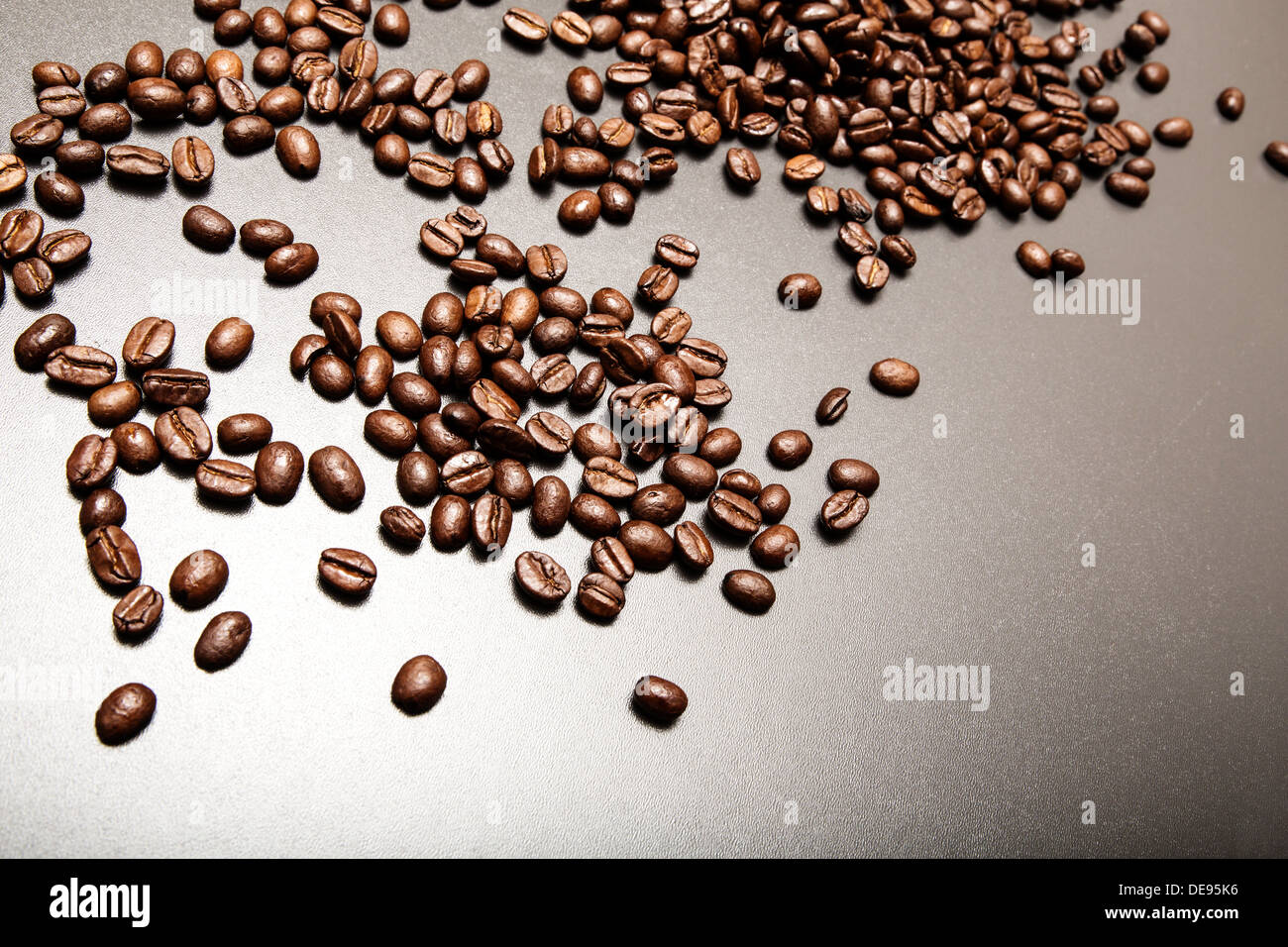 Roasted Coffee beans on a dark background Stock Photo - Alamy