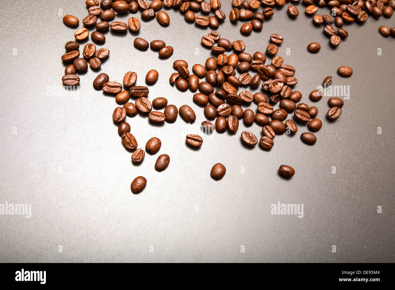 Roasted Coffee beans on a dark background Stock Photo - Alamy