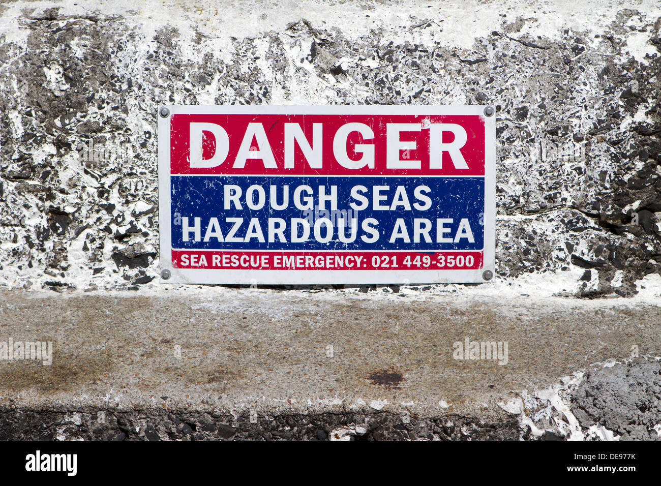 Warning sign on Kalk Bay Harbour. Stock Photo