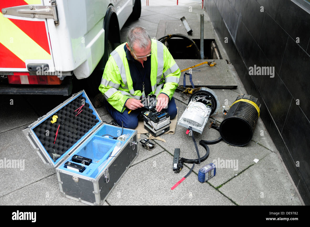 BT Engineer Installing And Repairing Fibre Optic Cable. Stock Photo
