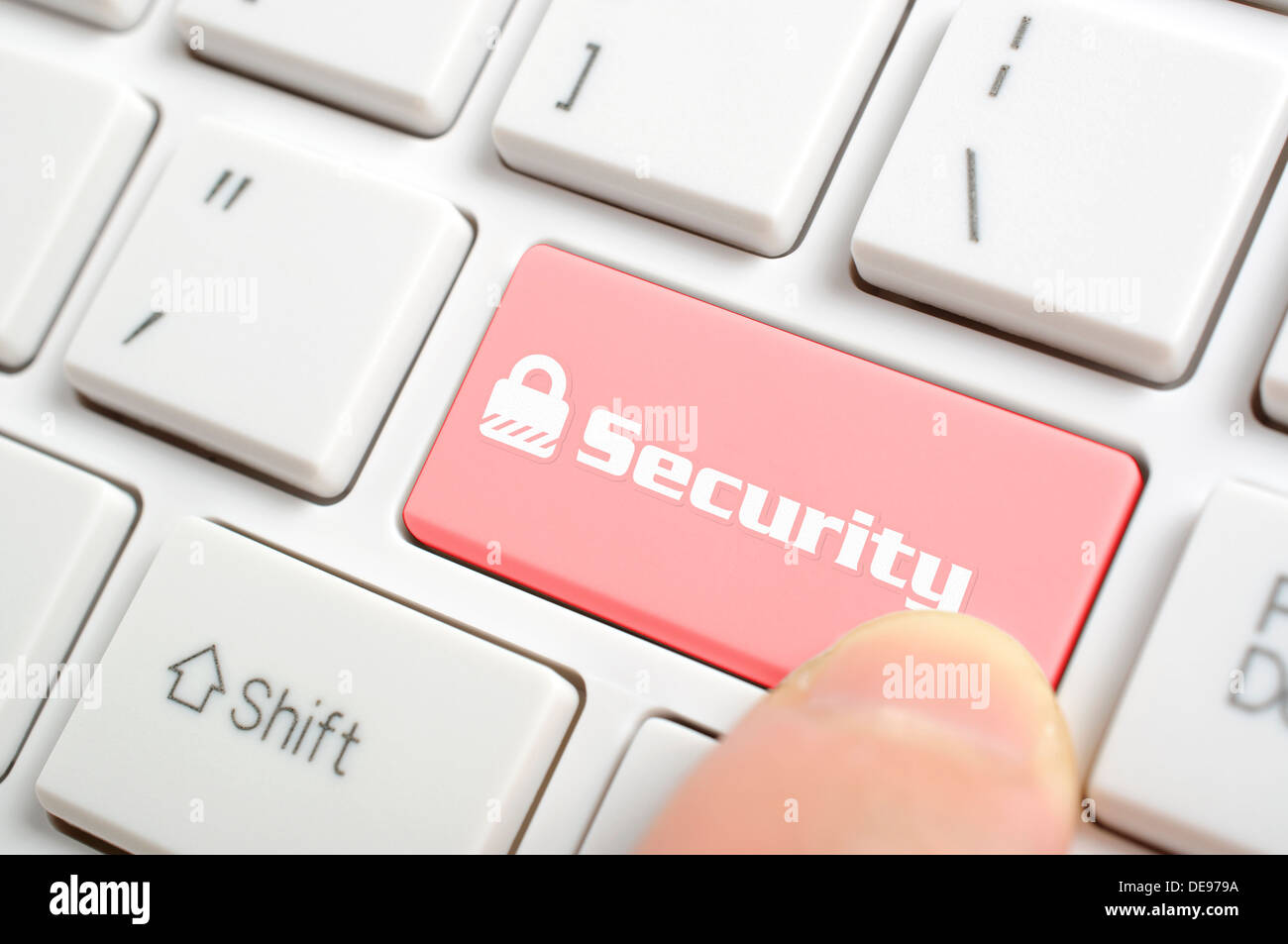 Pressing security key on keyboard Stock Photo