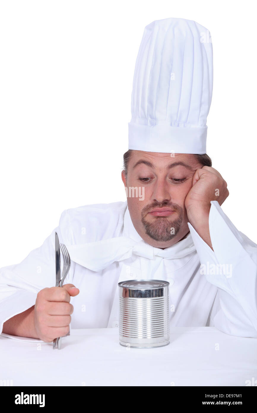 Cook with cutlery and tin can Stock Photo Alamy