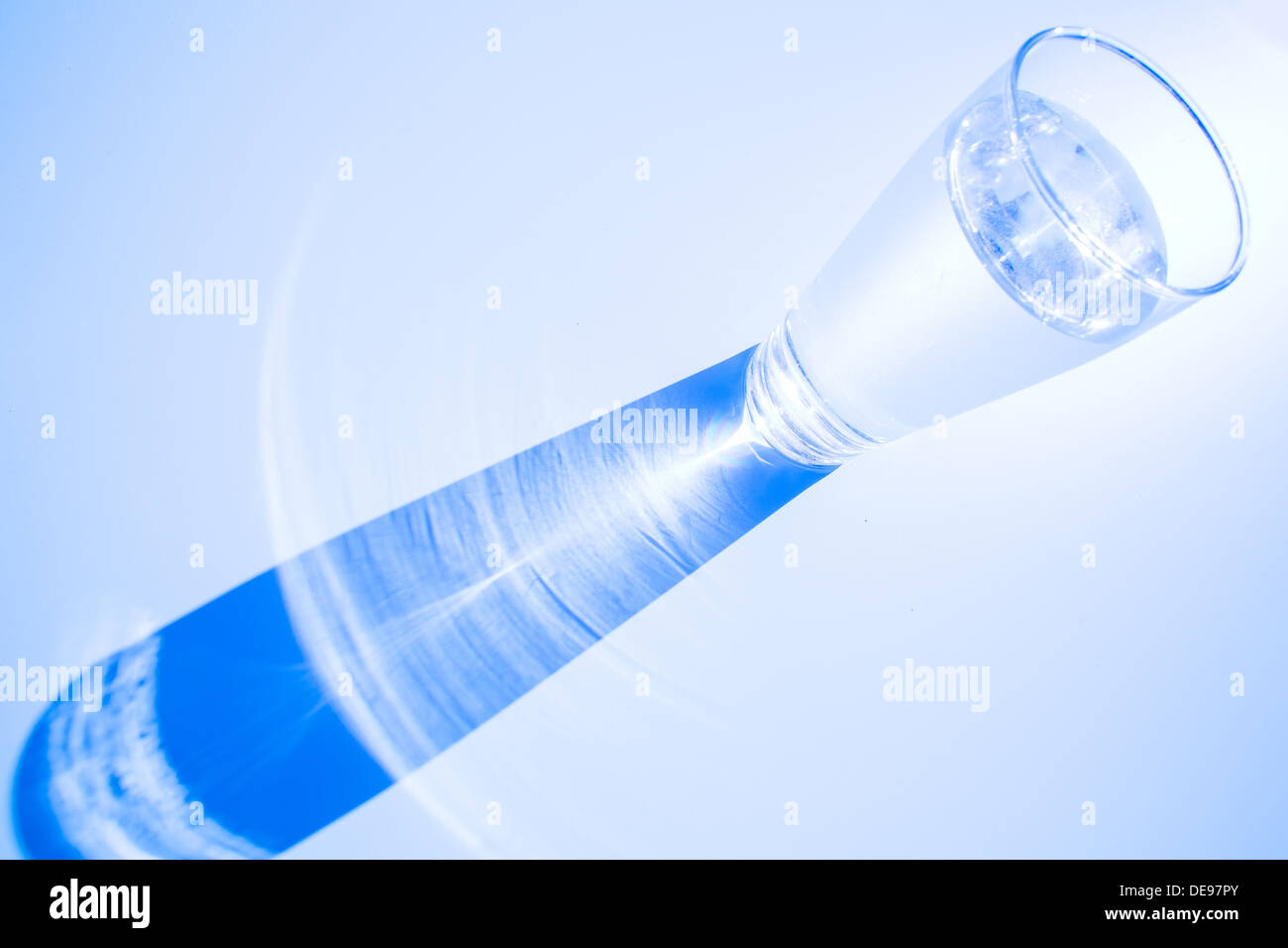 Caustic effect as light passes through a glass of water Stock Photo Alamy