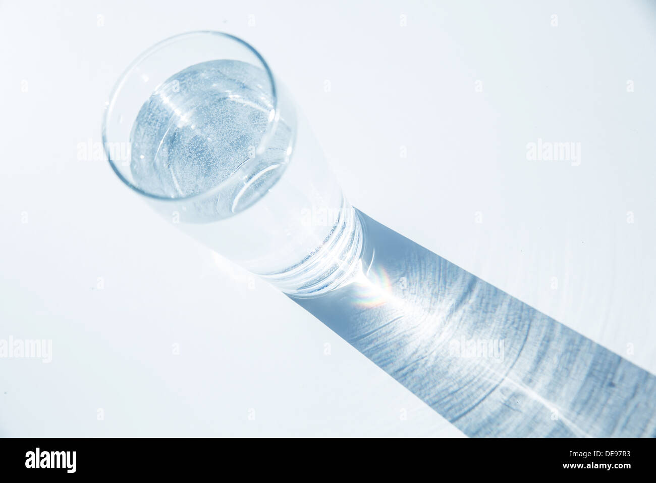 Caustic effect as light passes through a glass of water Stock Photo Alamy
