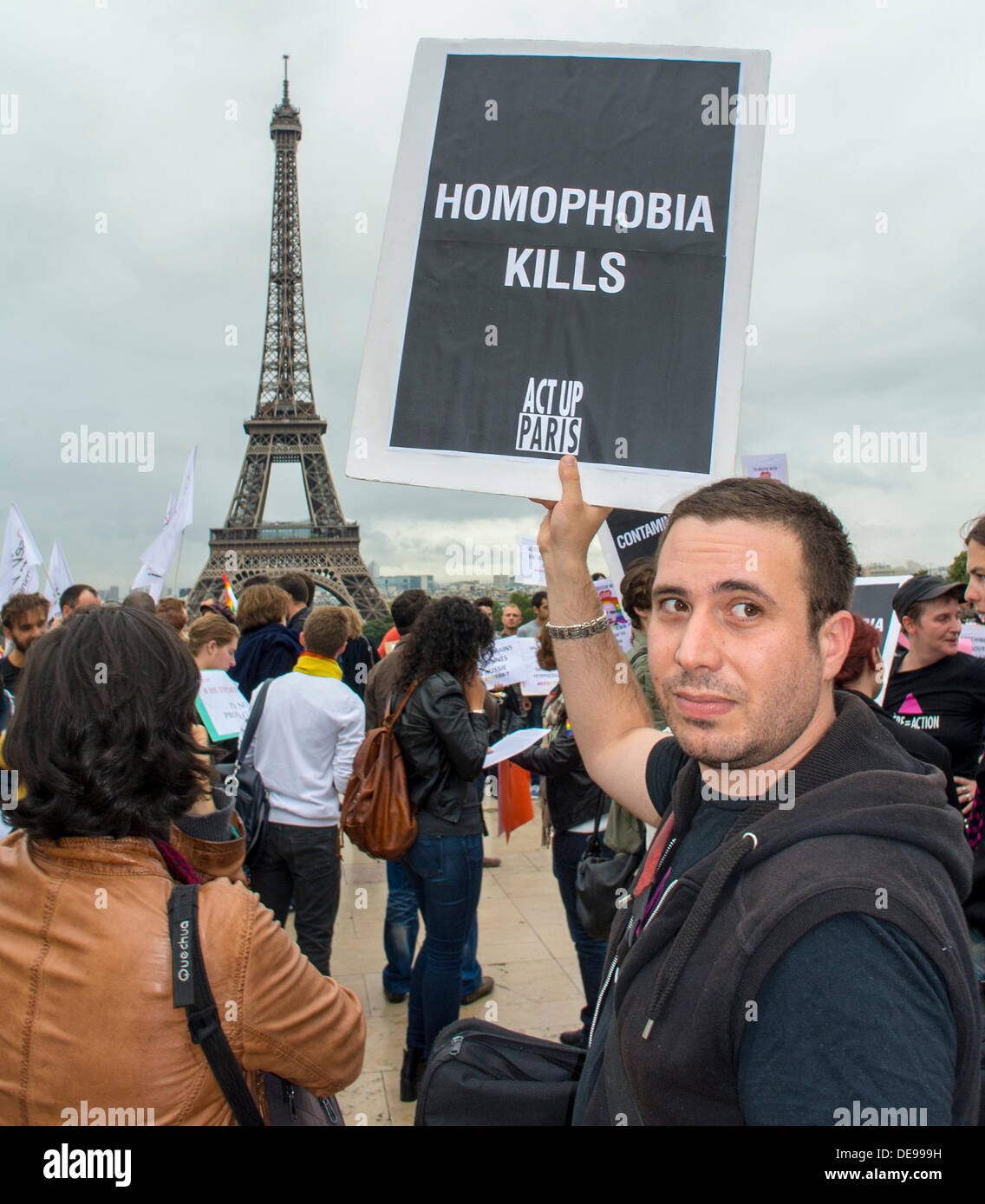 Paris, France. Several LGBT Activism Groups (Act Up-Paris) Against Homophobia Law, in Russia, Demonstration, Man Holding Sign 'Homophobia Kills' activist protes, gay men problemt, act up poster, violence against gay men, France Protests Stock Photo