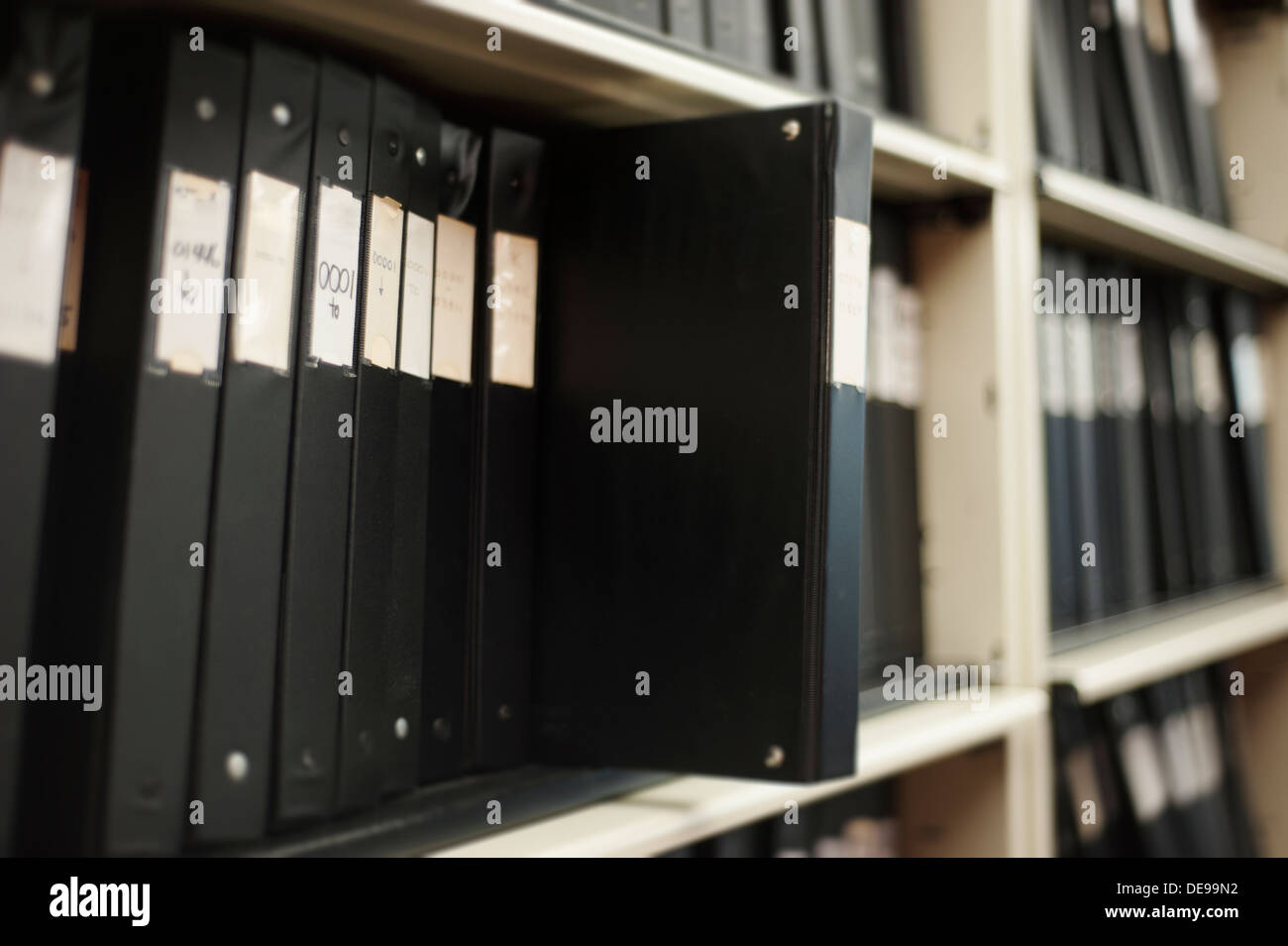 Old analogue binders for record-keeping on a bookshelf Stock Photo