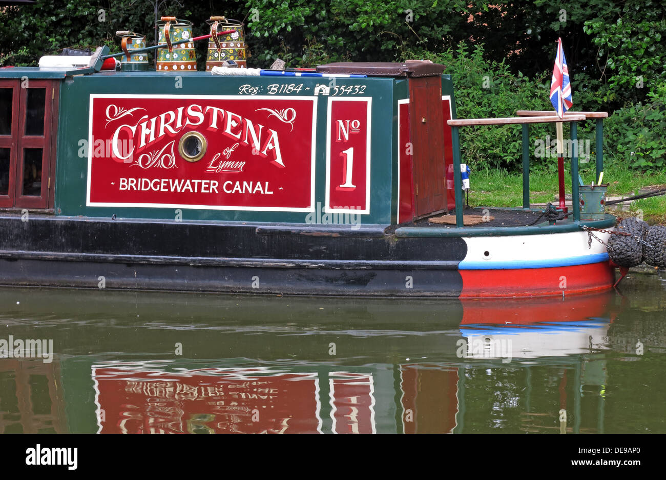Bridgewater Canal barge in red & green, at Grappenhall, Cheshire, England, UK Stock Photo