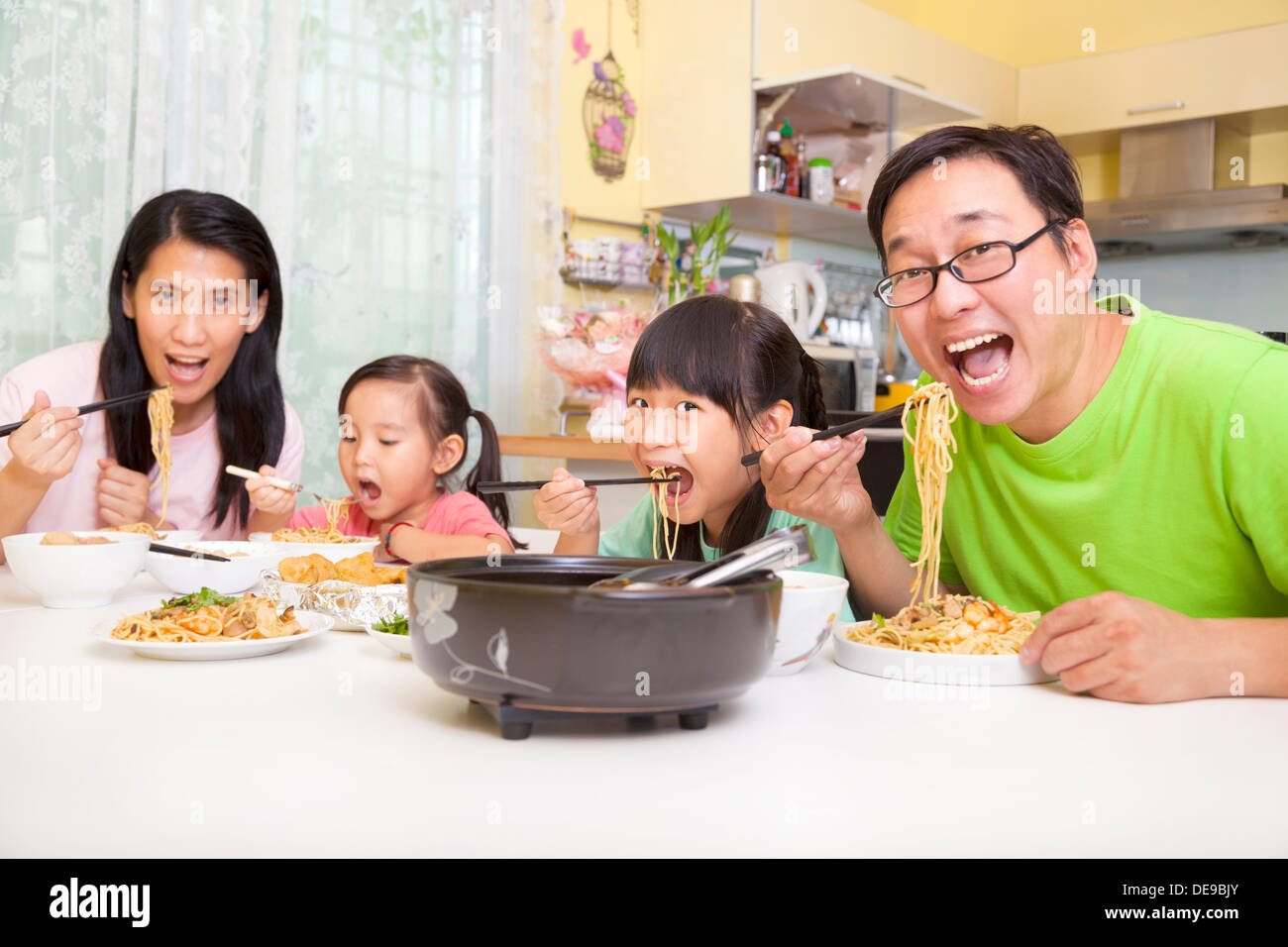 happy asian Family Eating noodles Stock Photo