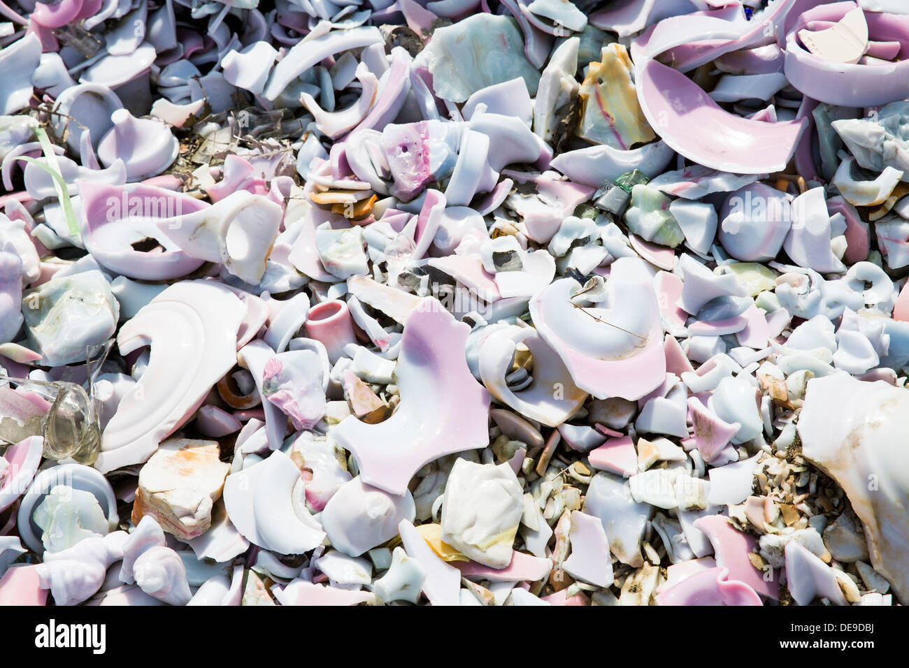 A scrap glass yard including stained glass and marbles. Stock Photo