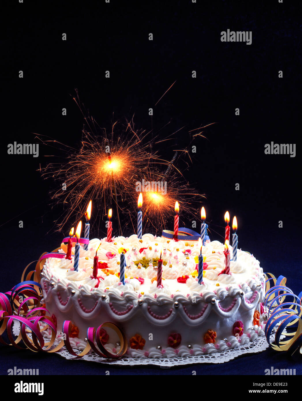 Birthday cake with burning candles Stock Photo - Alamy