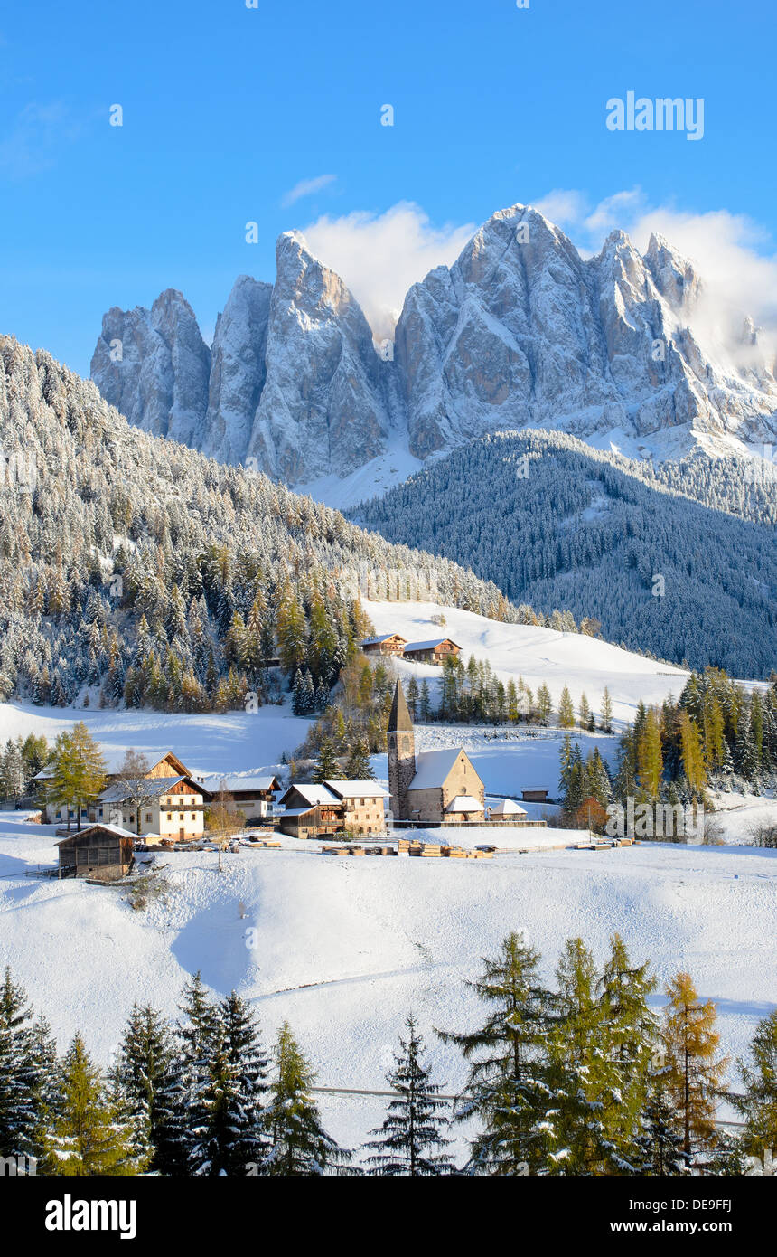 St. Magdalena or Santa Maddalena with its characteristic church in front of the Geisler, Odle, dolomites mountain peaks in Italy Stock Photo