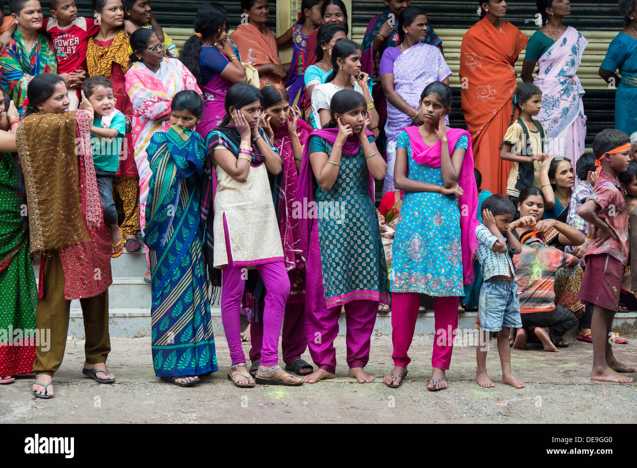 Indian girls and children watching a festival parade. Ganesha Chaturthi Festival,  Puttaparthi, Andhra Pradesh, India Stock Photo
