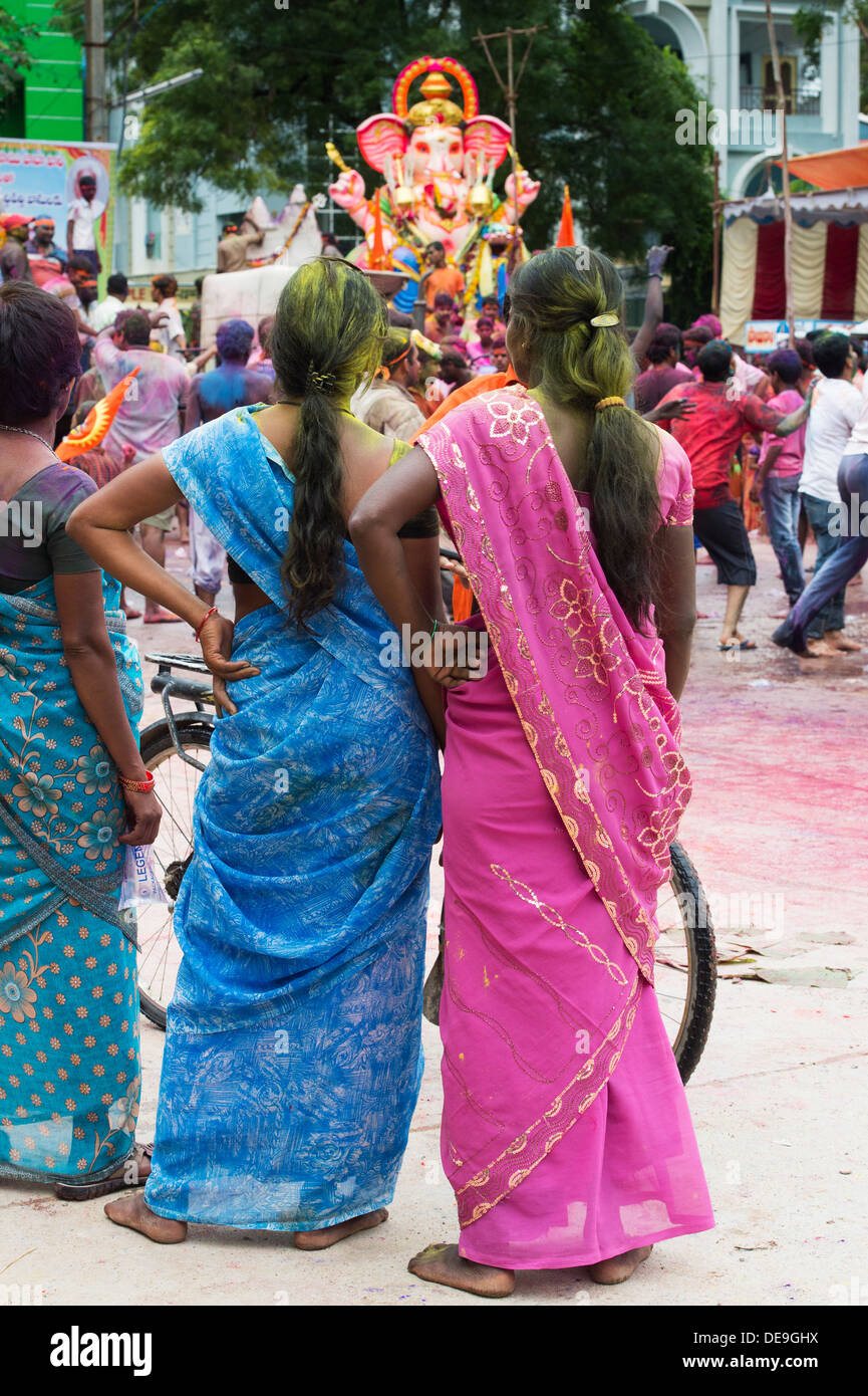 Indian women watching parade and Lord Ganesha statue. Ganesha Chaturthi Festival,  Puttaparthi, Andhra Pradesh, India Stock Photo