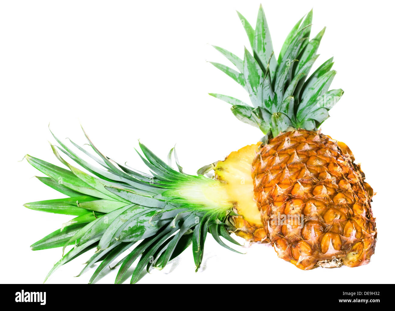 Pineapple cut in half on a white background isolated Stock Photo - Alamy