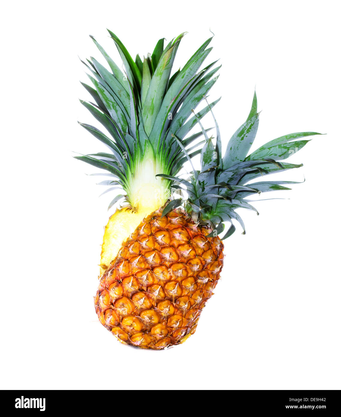 Pineapple cut in half on a white background isolated Stock Photo - Alamy