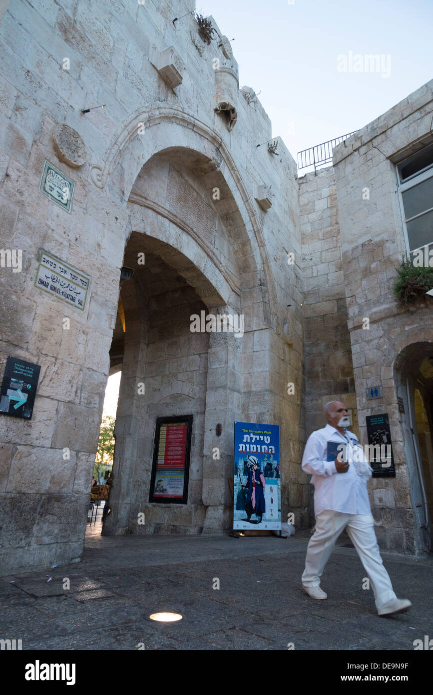 Jew in white clothes entering the Old City through Jaffa Gate. Jerusalem Old City. Israel. Stock Photo