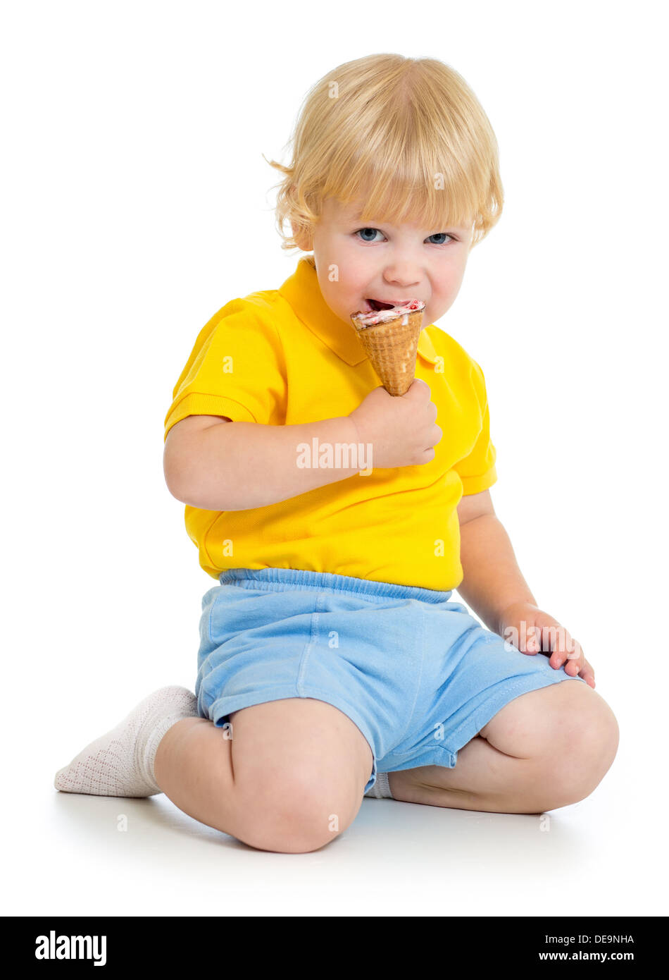 Kid boy eating ice cream isolated on white Stock Photo
