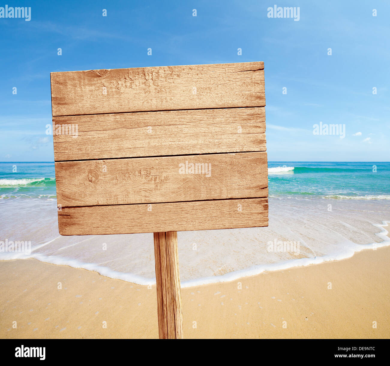 wood road sign on sea beach Stock Photo