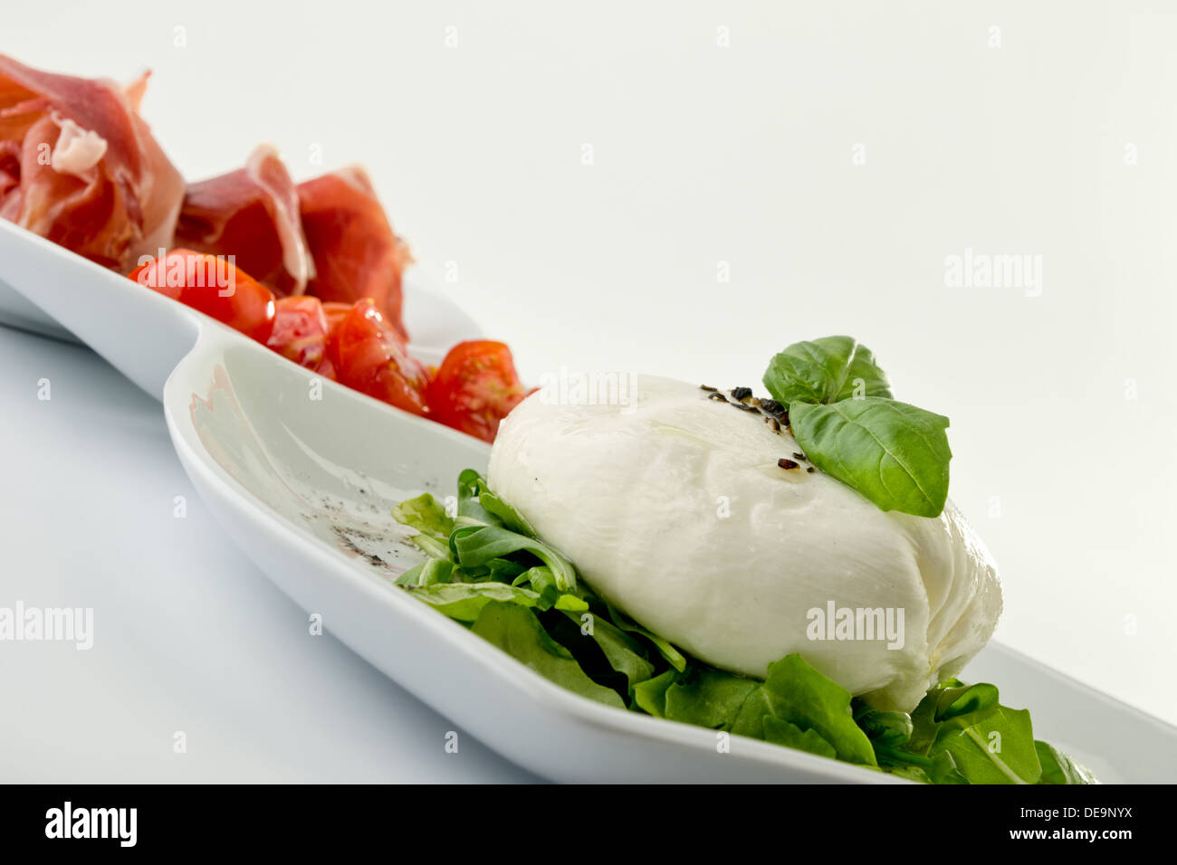 Burrata with prosciutto Stock Photo Alamy