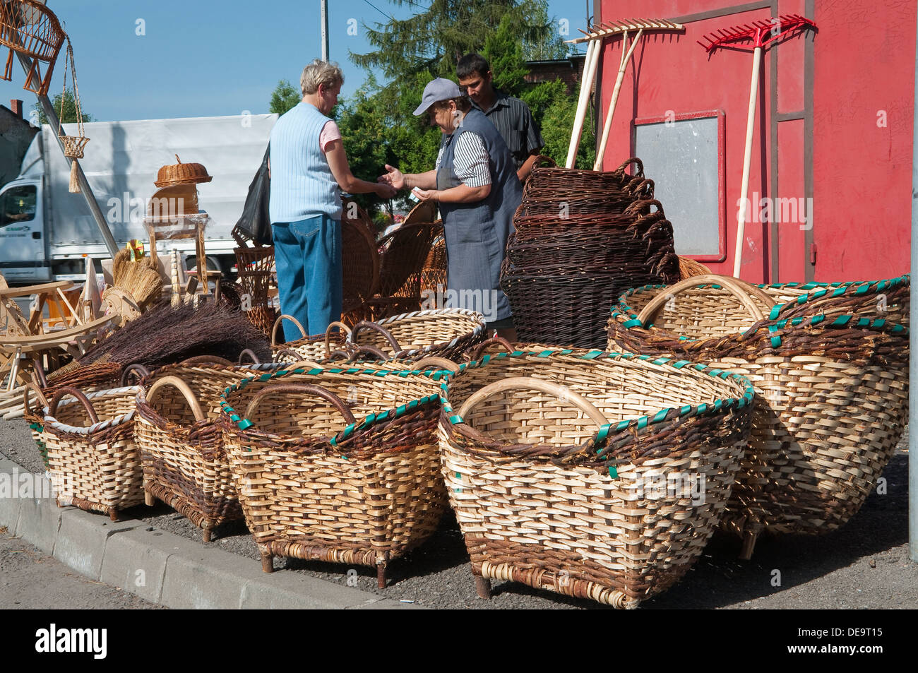 Woman selling traditional Polish wicker baskets at local craft fair in Wadowice, Poland. Stock Photo