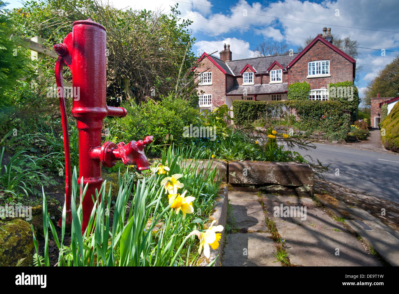 Old Water Pump in Spring, Village of Rostherne, near Knutsford, Cheshire, England, UK Stock Photo