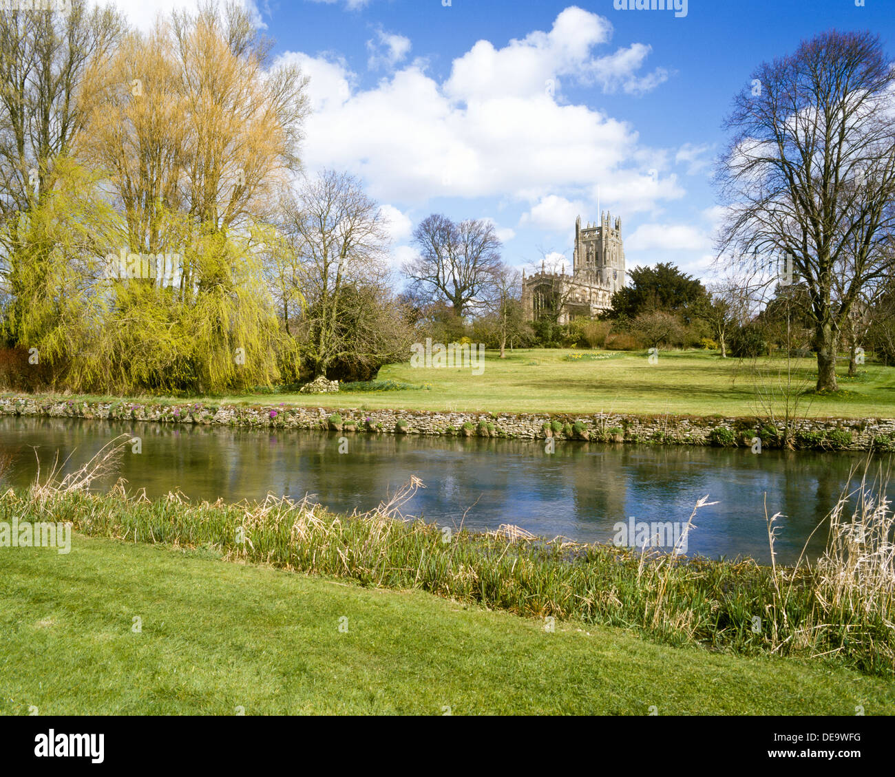 St. Mary's Church beside the River Coln in the Cotswold town of Fairford, Gloucestershire UK Stock Photo