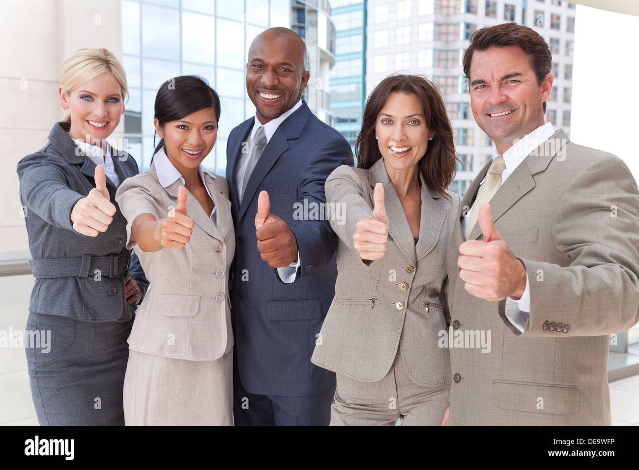 Successful positive interracial group of business men & women Stock