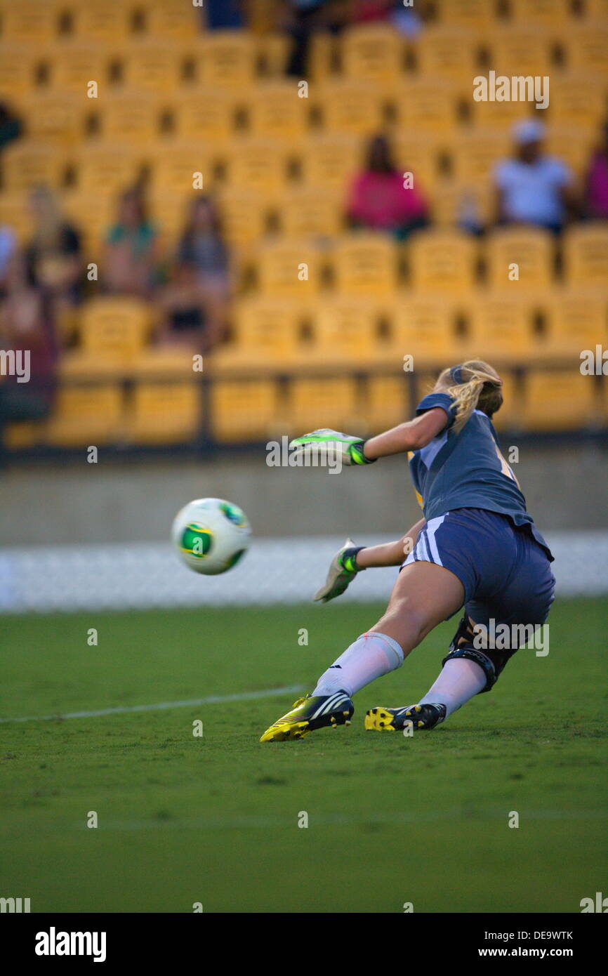 Kennesaw, Georgia.  USA.   September 13, 2013.   KSU goalie Olivia Sturdivant makes a diving stop during Ole Miss' 2-1 win over Kennesaw State at Fifth Third Bank Stadium.  Women's NCAA Division I Soccer. Stock Photo