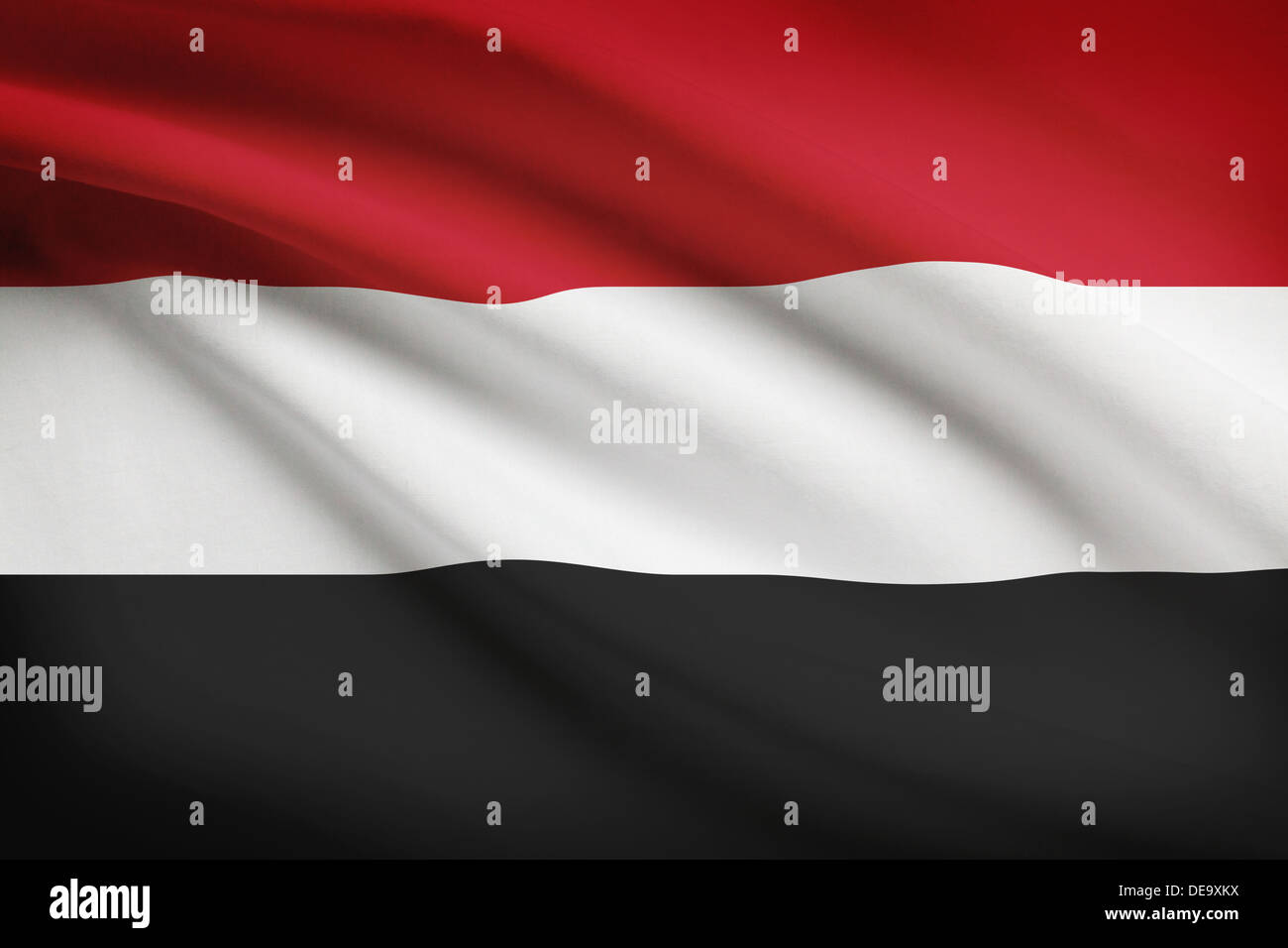 Yemeni flag blowing in the wind. Part of a series. Stock Photo