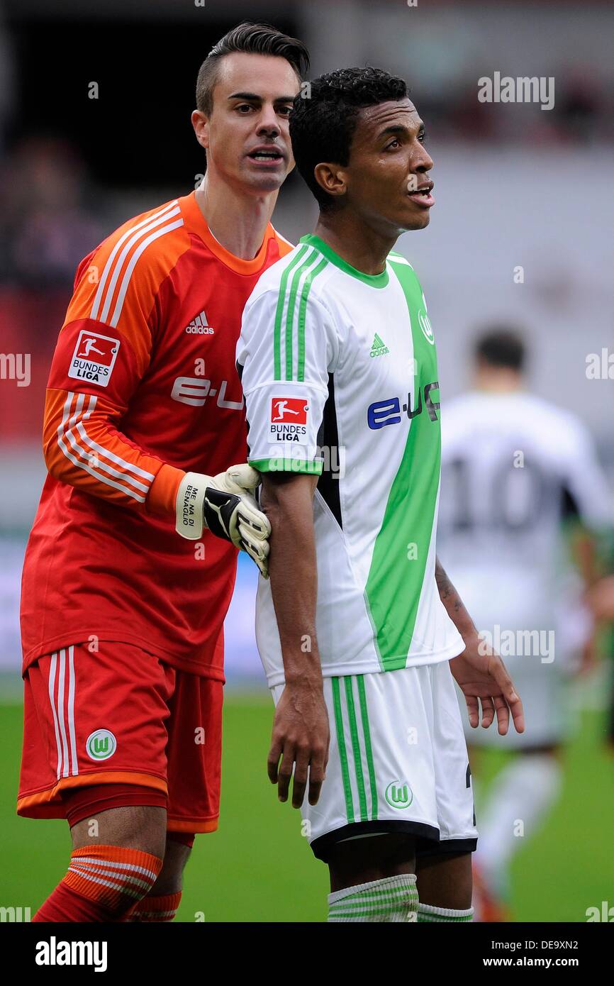 Leverkusen, Germany. 14th Sep, 2013. Wolfsburg's goalkeeper Diego Benaglio pushes Luiz Gustavo to the side after the match during the German Bundesliga match between Bayer Leverkusen and VfL Wolfsburg at BayArena in Leverkusen, Germany, 14 September 2013. Photo: MARIUS BECKER/dpa/Alamy Live News Stock Photo