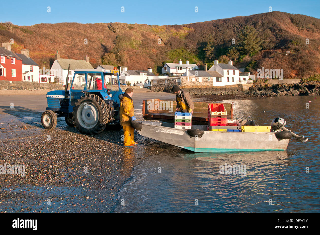 Fishermen Launching Boat at Porth Dinllaen, Llŷn Peninsula, North Wales, UK Stock Photo