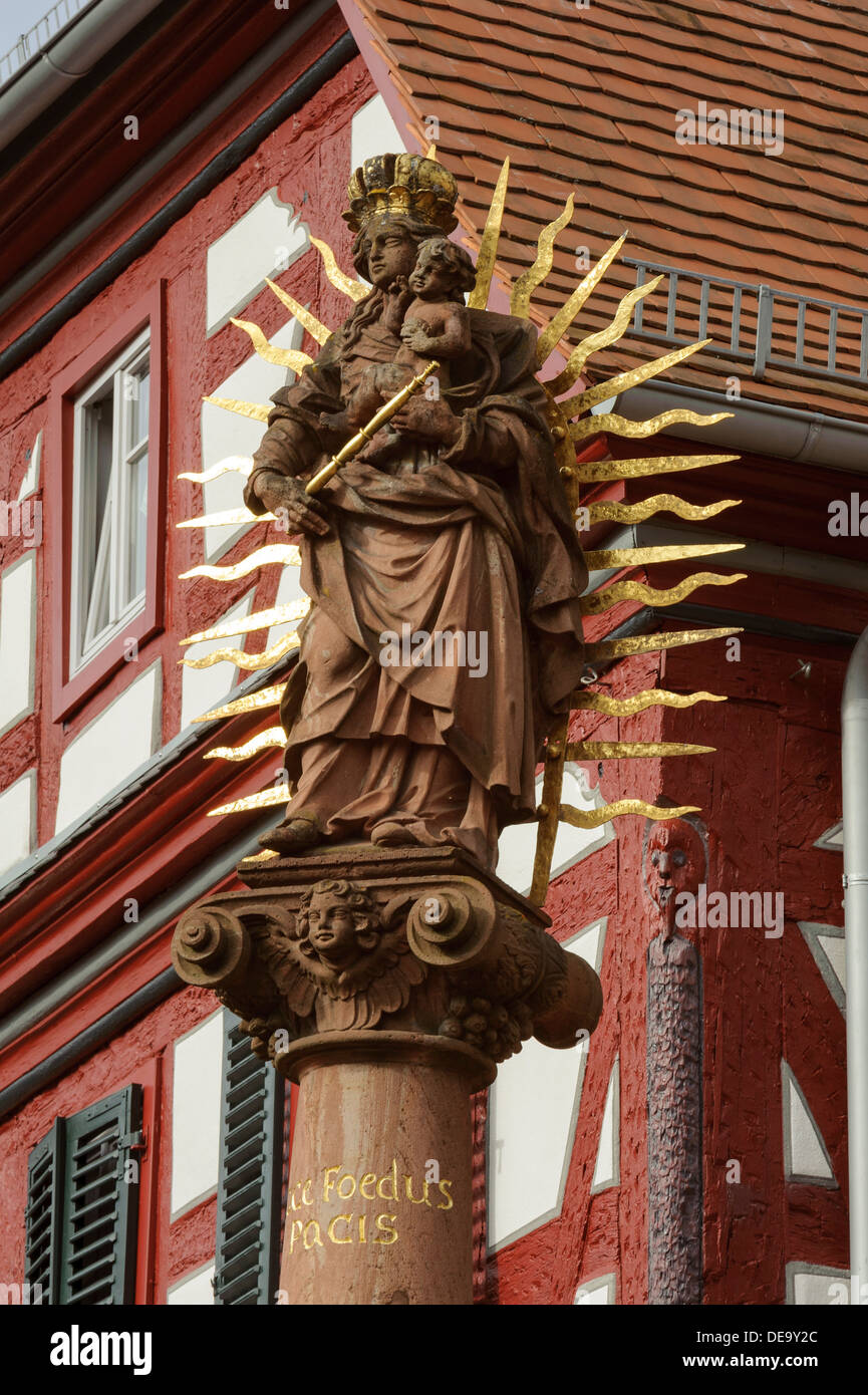 Debon-House and Marian column from 1729 in Amorbach , Forest of Odes Bavaria, Germany Stock Photo
