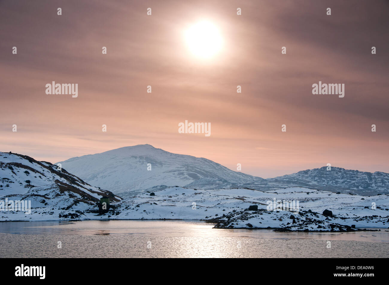 Moel Siabod & The Carneddau Mountains at Sunrise in Winter, Over Llyn Llydaw, Snowdonia National Park, North Wales, UK Stock Photo