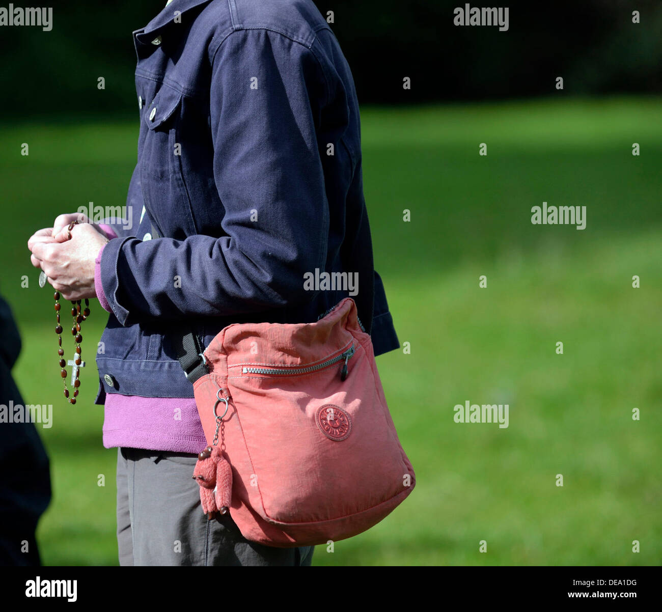 Woman holds rosary beads hi-res stock photography and images - Alamy