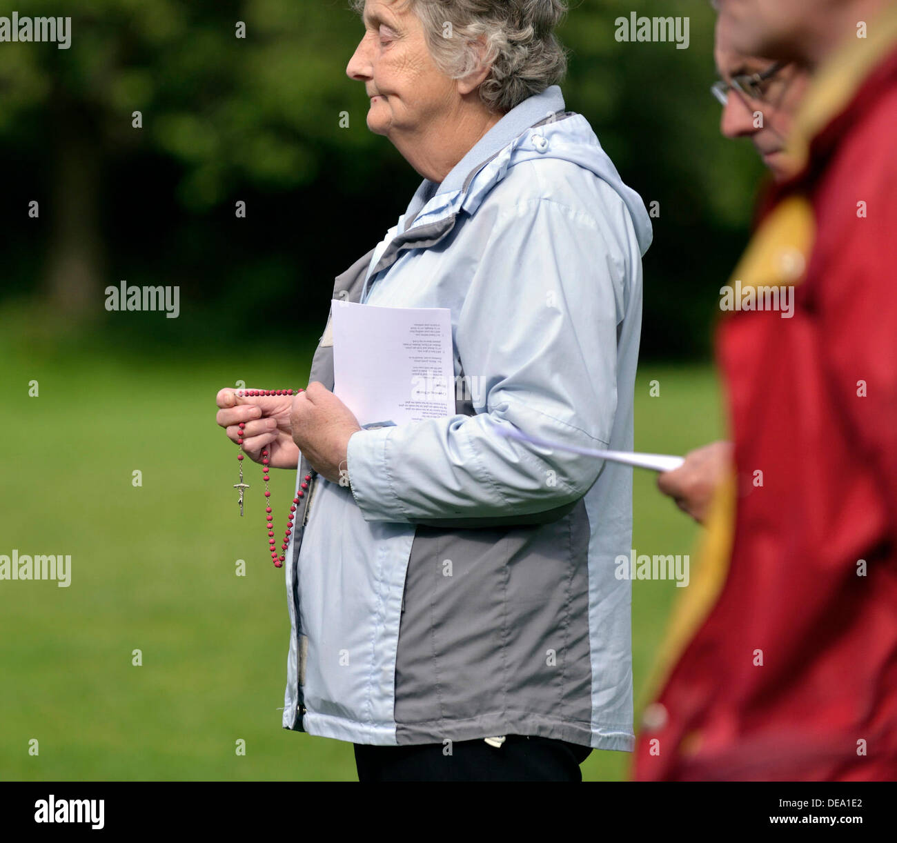 Woman holds rosary beads hi-res stock photography and images - Alamy