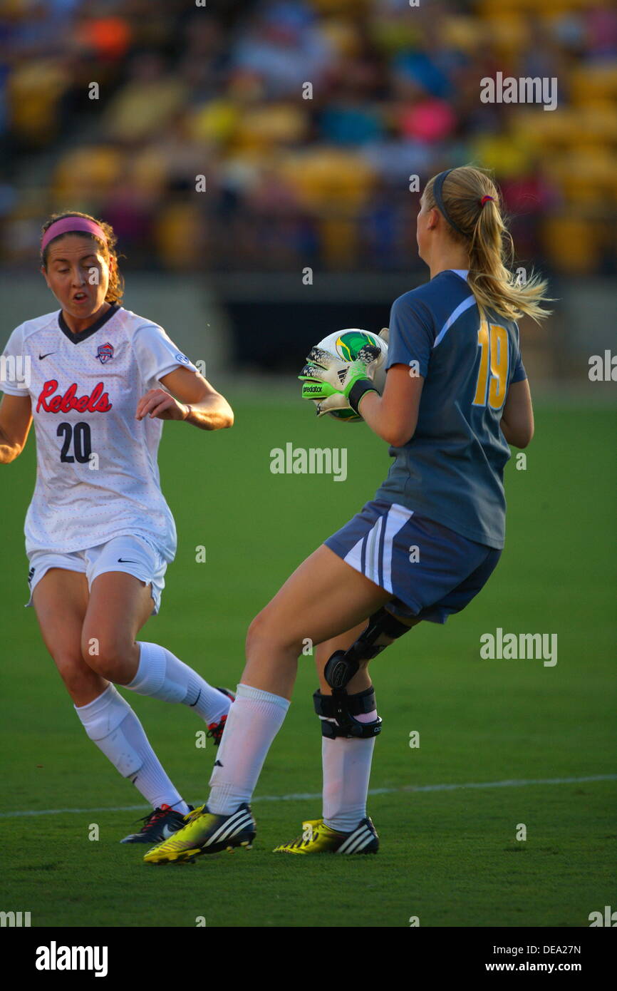 Kennesaw, Georgia.  USA.   September 13, 2013.   Goalie Olivia Sturdivant takes the ball away from Olivia Harrison (20) during Ole Miss' 2-1 win over Kennesaw State at Fifth Third Bank Stadium.  Women's NCAA Division I Soccer. © Wayne Hughes/Alamy Live News Stock Photo