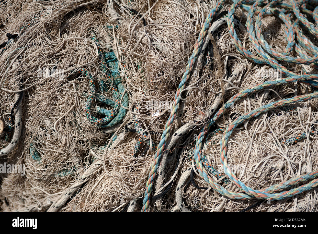 a tangled mess of fishing nets and rope filling the frame Stock Photo -  Alamy