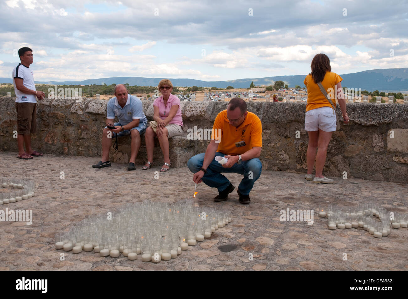 People lighting candles before the Candles Concert. Pedraza, Segovia province, Castilla Leon, Spain. Stock Photo